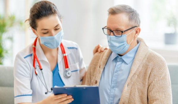 doctor-and-senior-man-wearing-facemasks-740x512